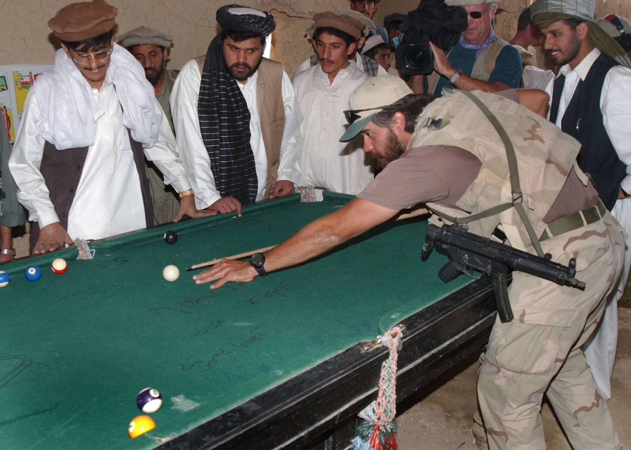 Army Special Forces soldier plays pool