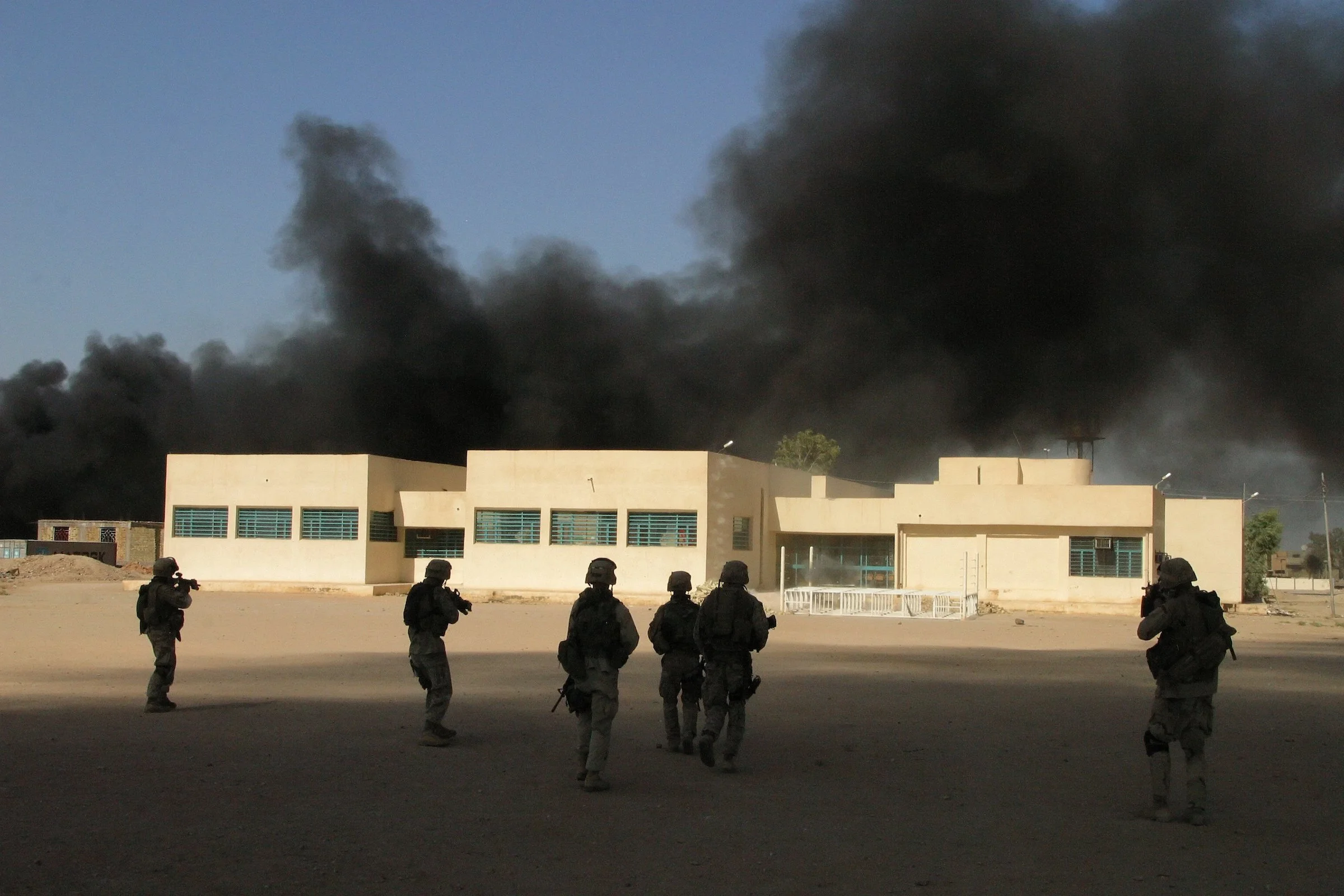 US Marines from Charlie Company 1/4 3rd Platoon approach a building in Iraq