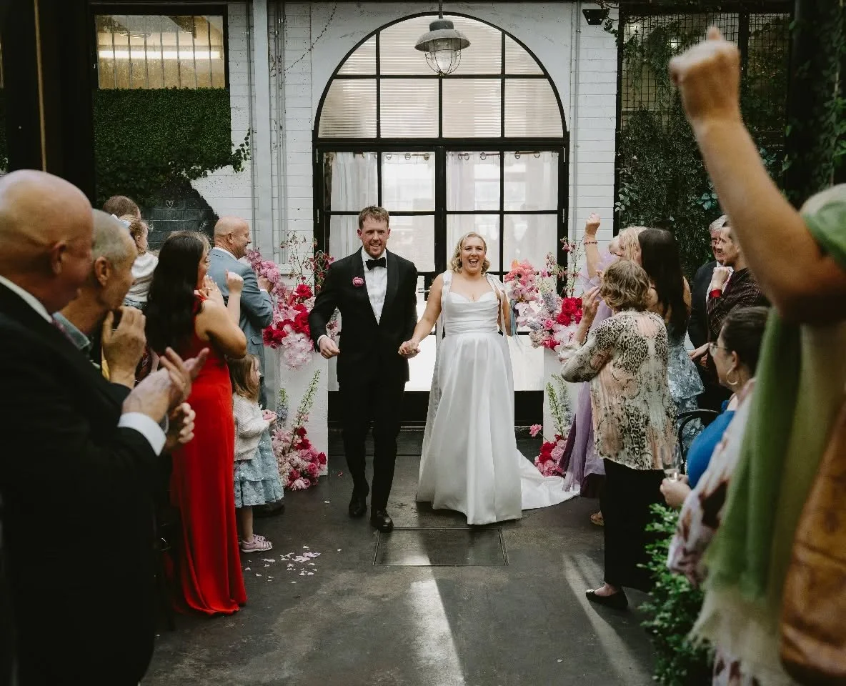Yalleen and Dan!!! 
Beginning with the cutest aisle walk of their little neices and nephews, incorporating a family tradition when it came to saying their vows and ending ceremony with a very loud, happy group of guests cheering them back down as NEW