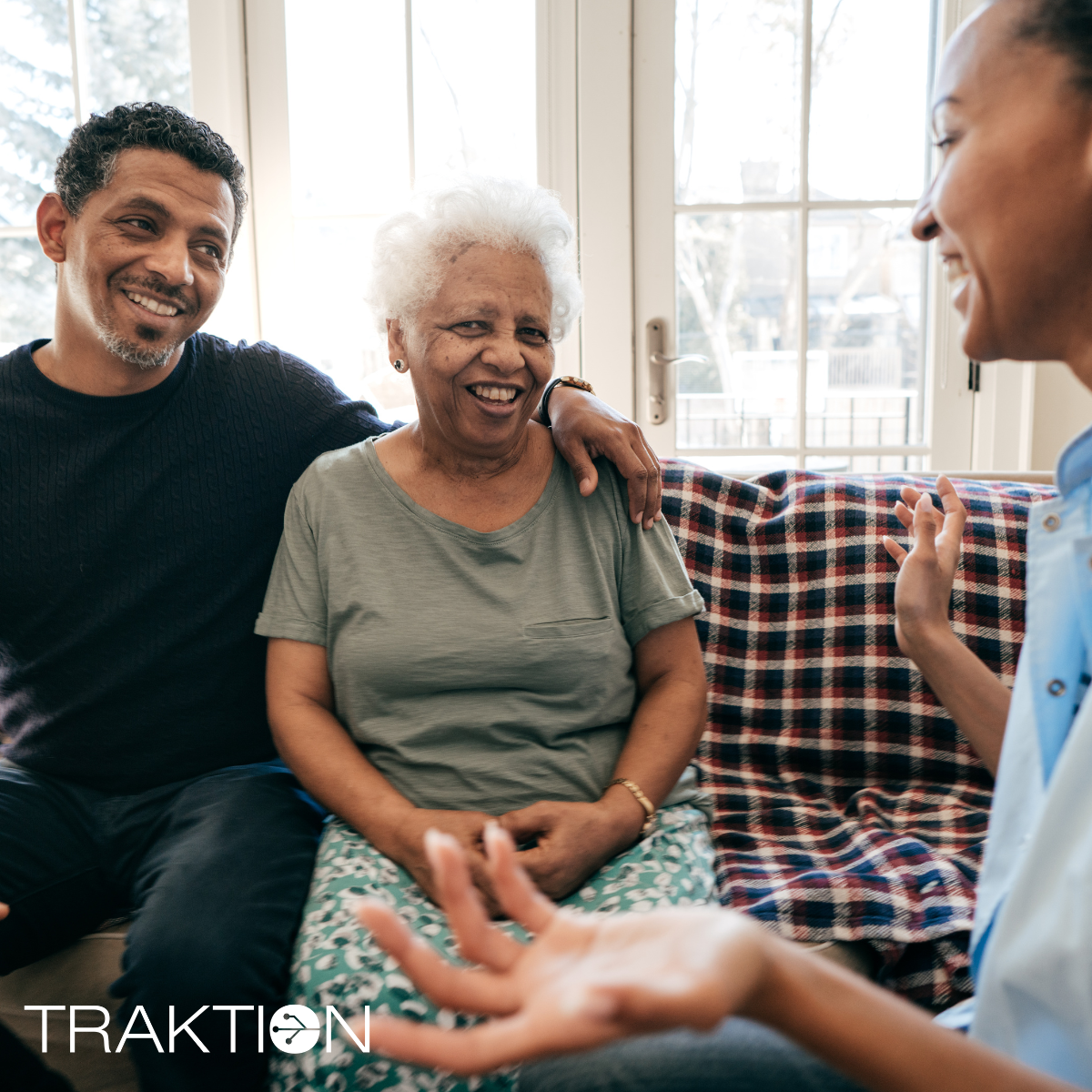 Image of two people, one a senior, talking with a provider