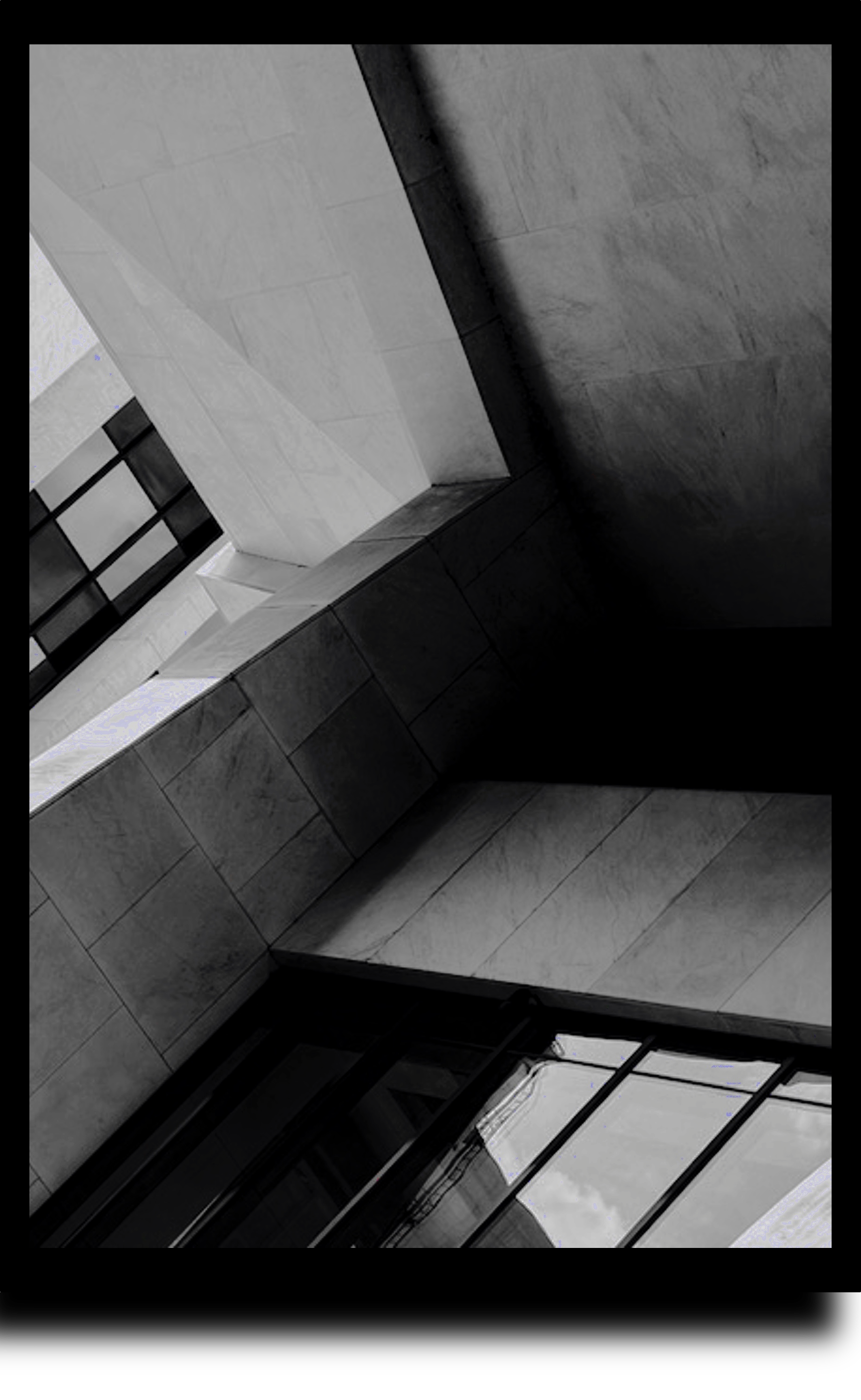Abstract architectural interior in downtown Portland with sharp angles, shadow, and empty space.