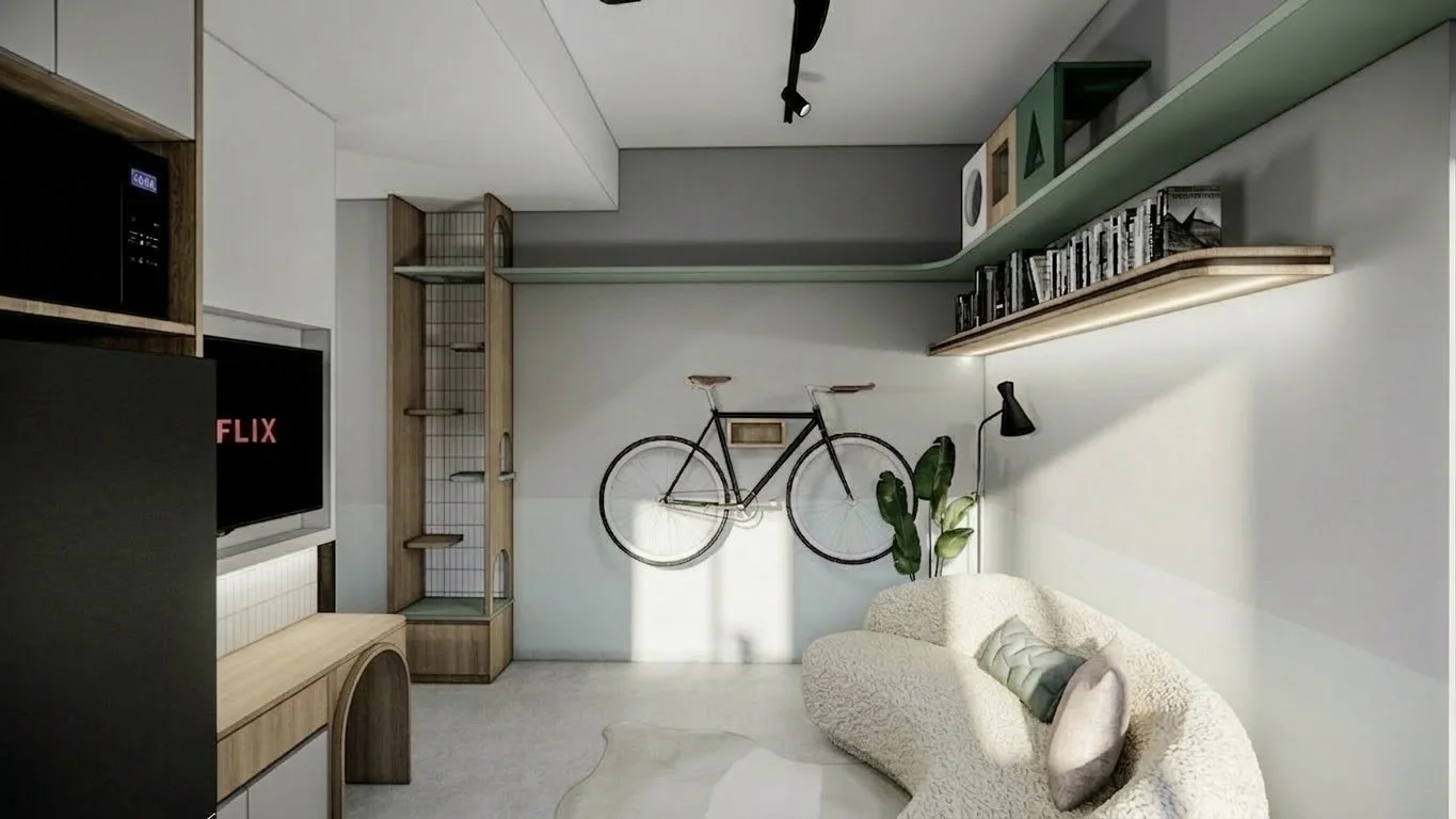Living room with a wall-mounted bicycle, a beige plush sofa with pillows, a black floor lamp, a green plant, a wall-mounted green shelf with decor, and a television showing Netflix.