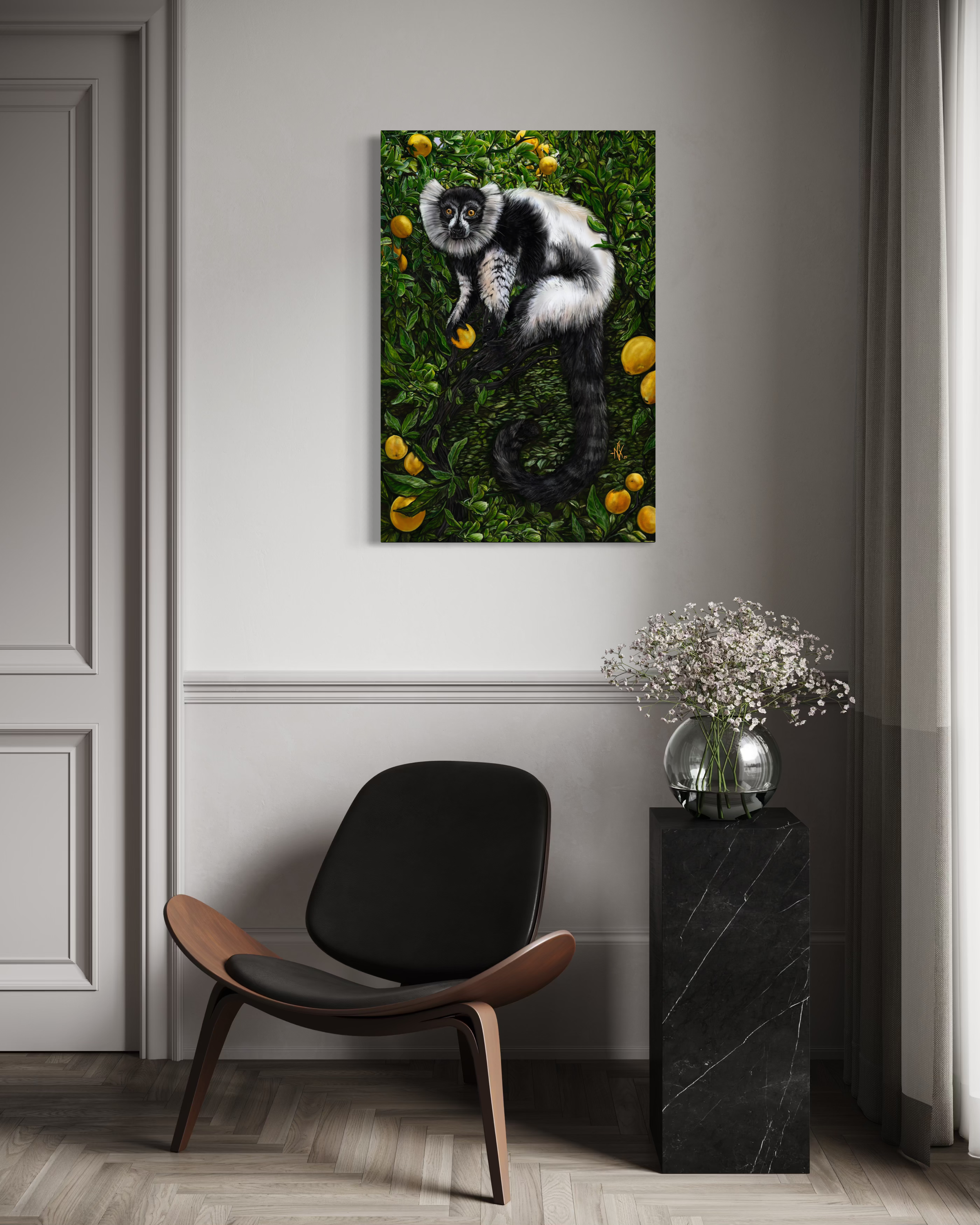 A modern interior with a black and wood lounge chair beneath a colorful painting of a black and white animal with a long tail, set against lush green leafy background with yellow fruit.