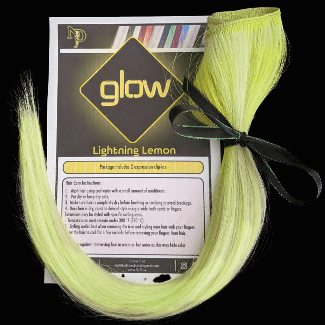 Bright yellow hair extension with a black ribbon, placed on a product packaging label for 'Glow Lightning Lemon' hair color styling clips.