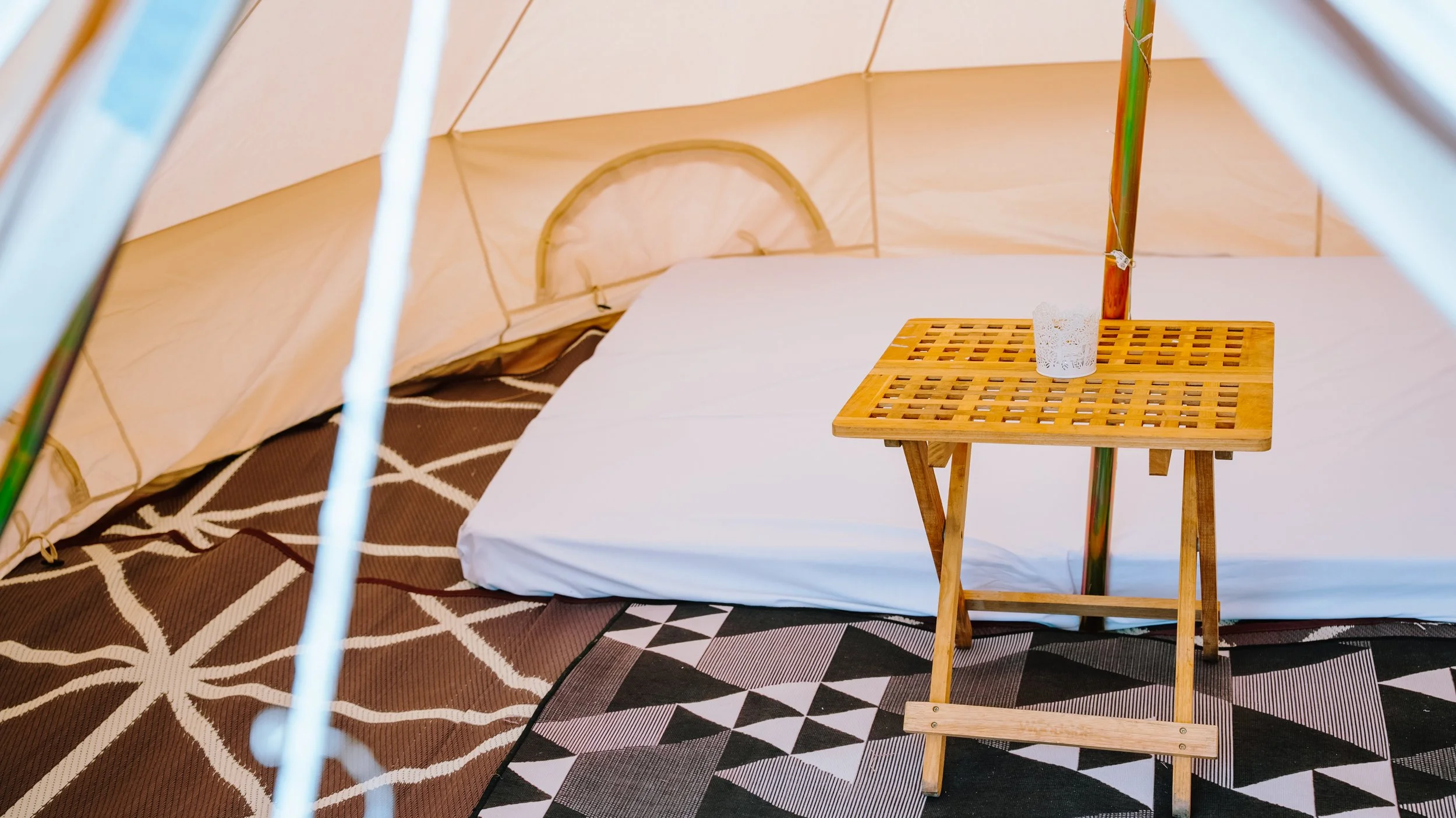 Basic bell tent with airbeds and sheets at Pitstop Glamping