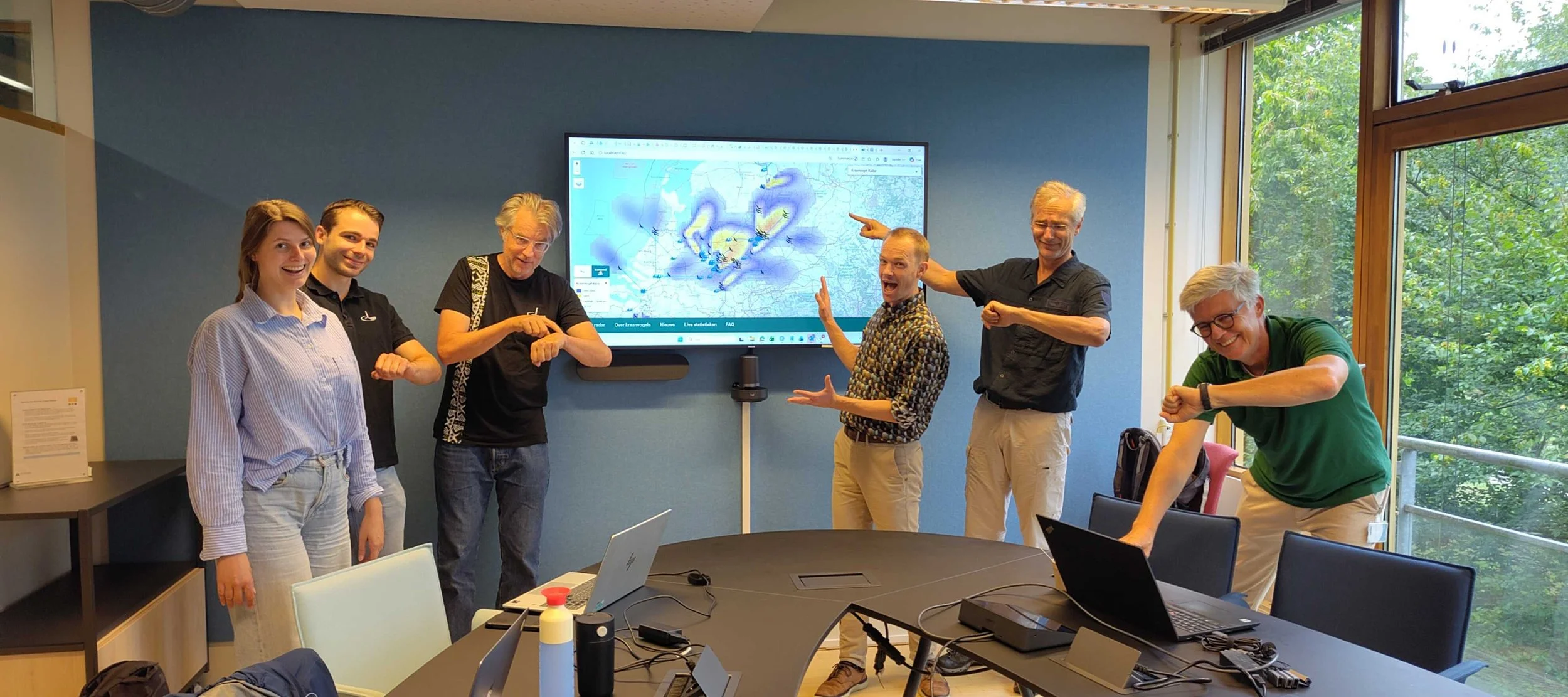 Melanie, Bas, Hugo, Koen, Jan-Kees, and Menno excited about the forecast