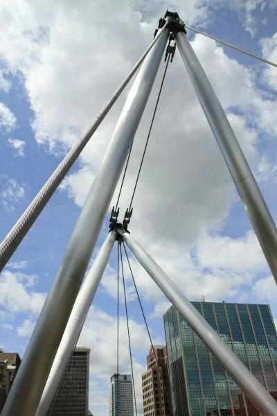 Close-up “The Arch sculpture welcoming bridge walkers into downtown Hartford.”