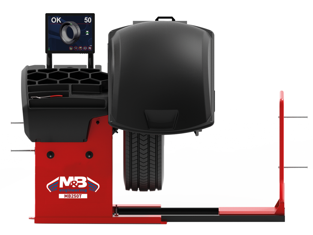 Un dispositif de test de pneumatiques, avec un poste informatique affichant une indicatrice de pression et une machine pour tester la stabilité des pneus.