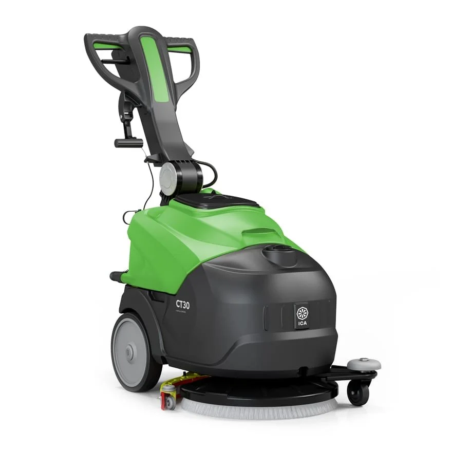 Une machine de nettoyage industrielle pour sol, de couleur noire et verte, avec une brosse rotative en dessous.