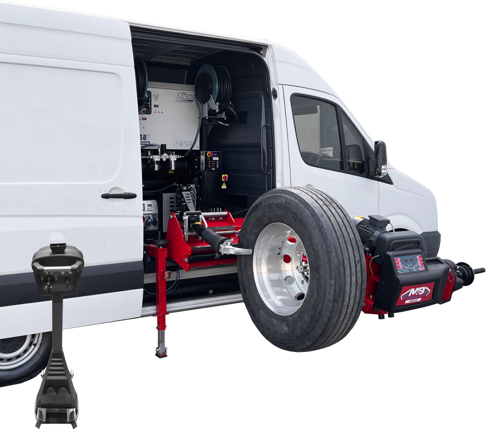 Camion blanc équipé d'une machine de test de pneu, avec un pneu de camion placé devant la machine pour mesurer ou tester.