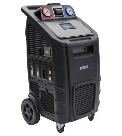 Un appareil de service de maintenance avec roulettes, panneaux de contrôle, manomètres et écran.