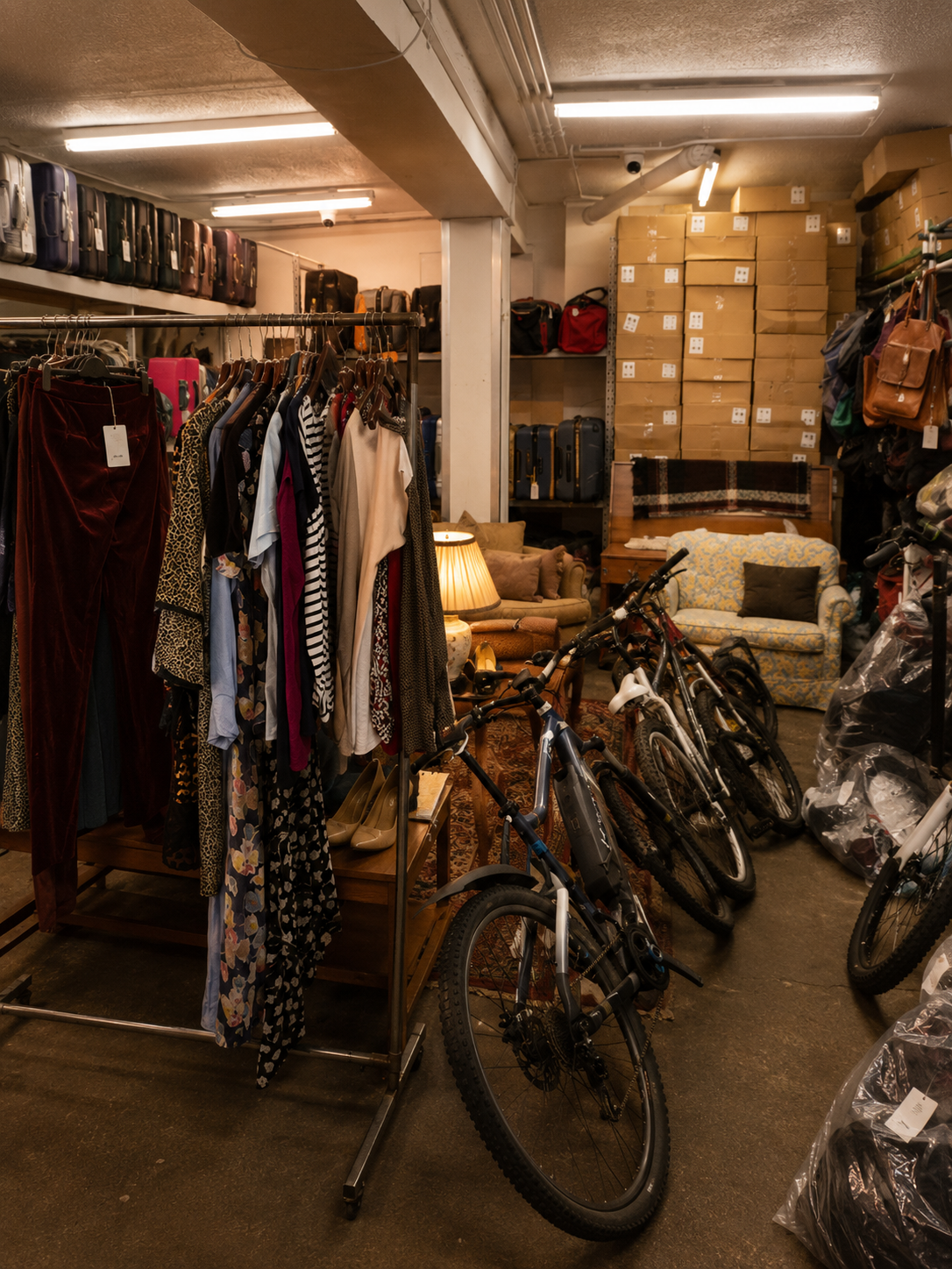 Clothing, bicycles, luggage and household items in the Greasby’s Auctioneers sale room