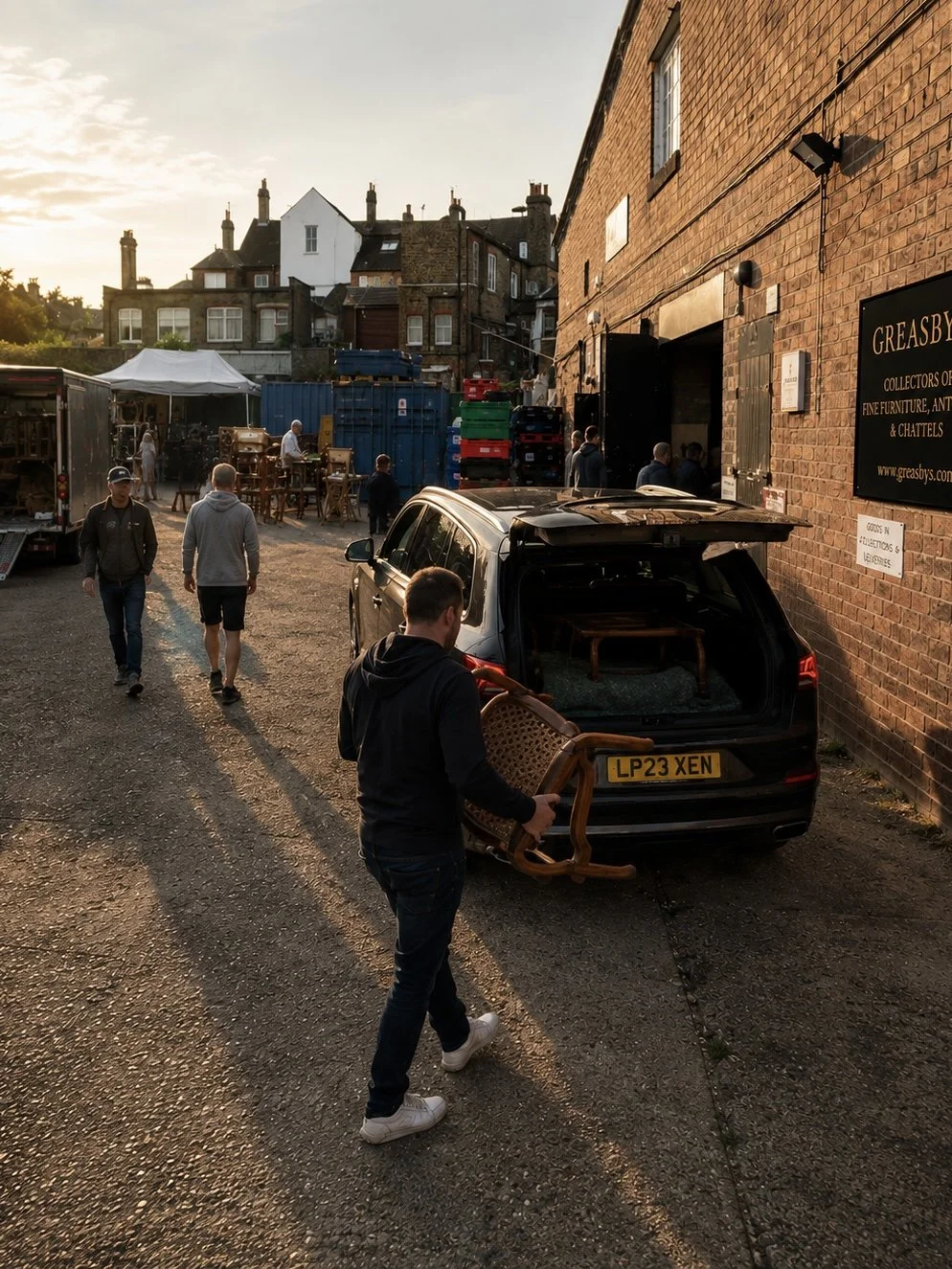 Customer collecting furniture from the Greasby’s Auctioneers auction yard