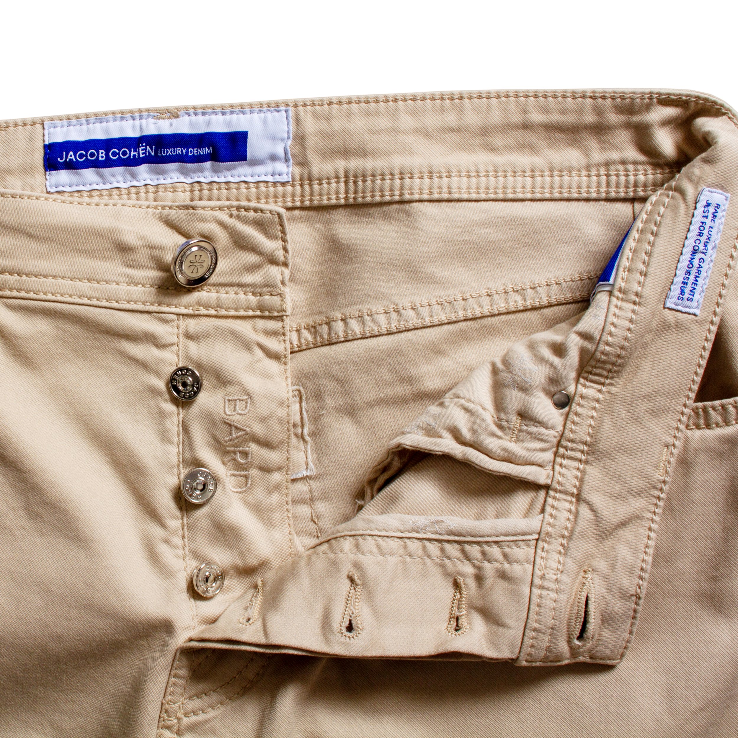 Close up image of Jacob Cohen beige chinos buttons.