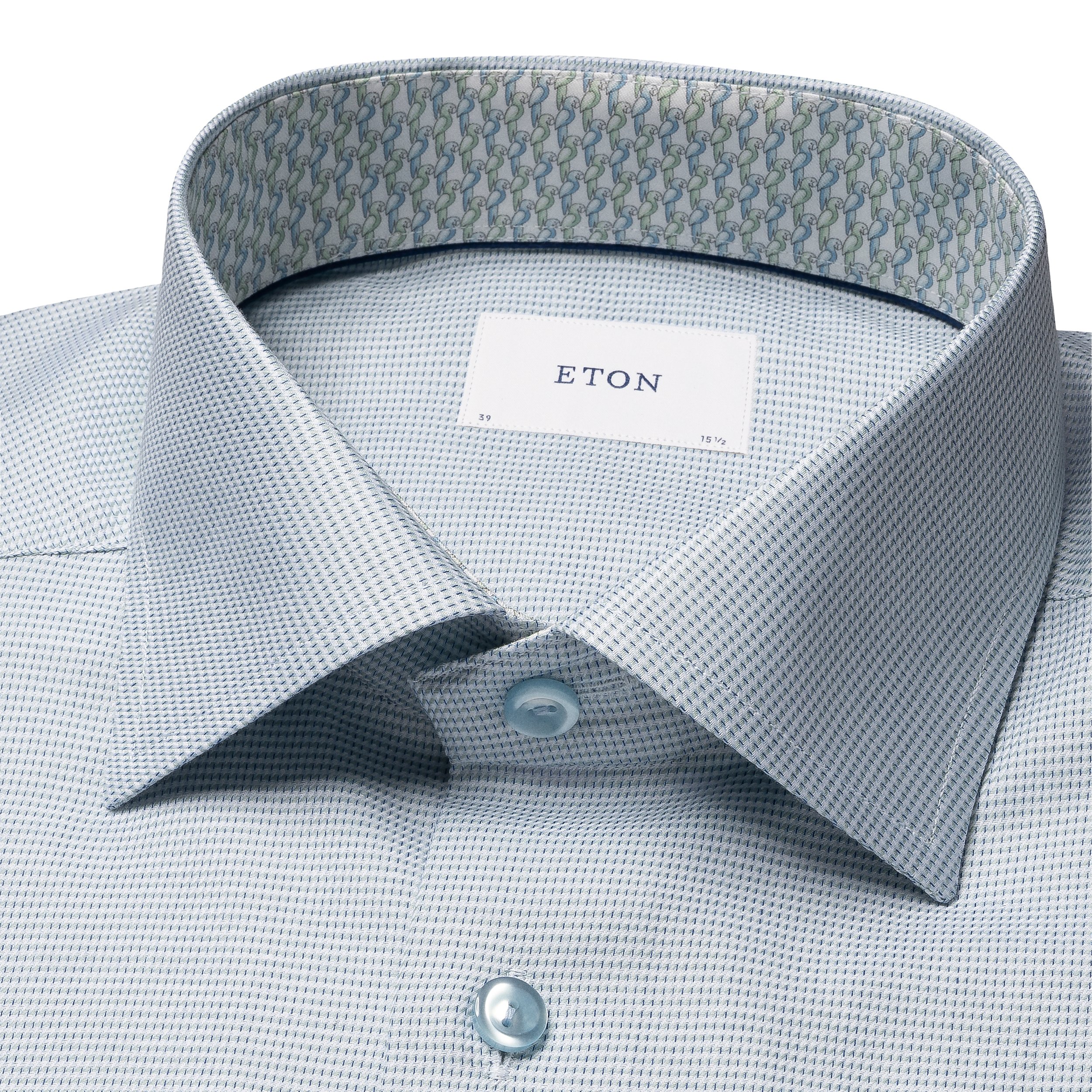 Close up image of eton shirt in green's collar
