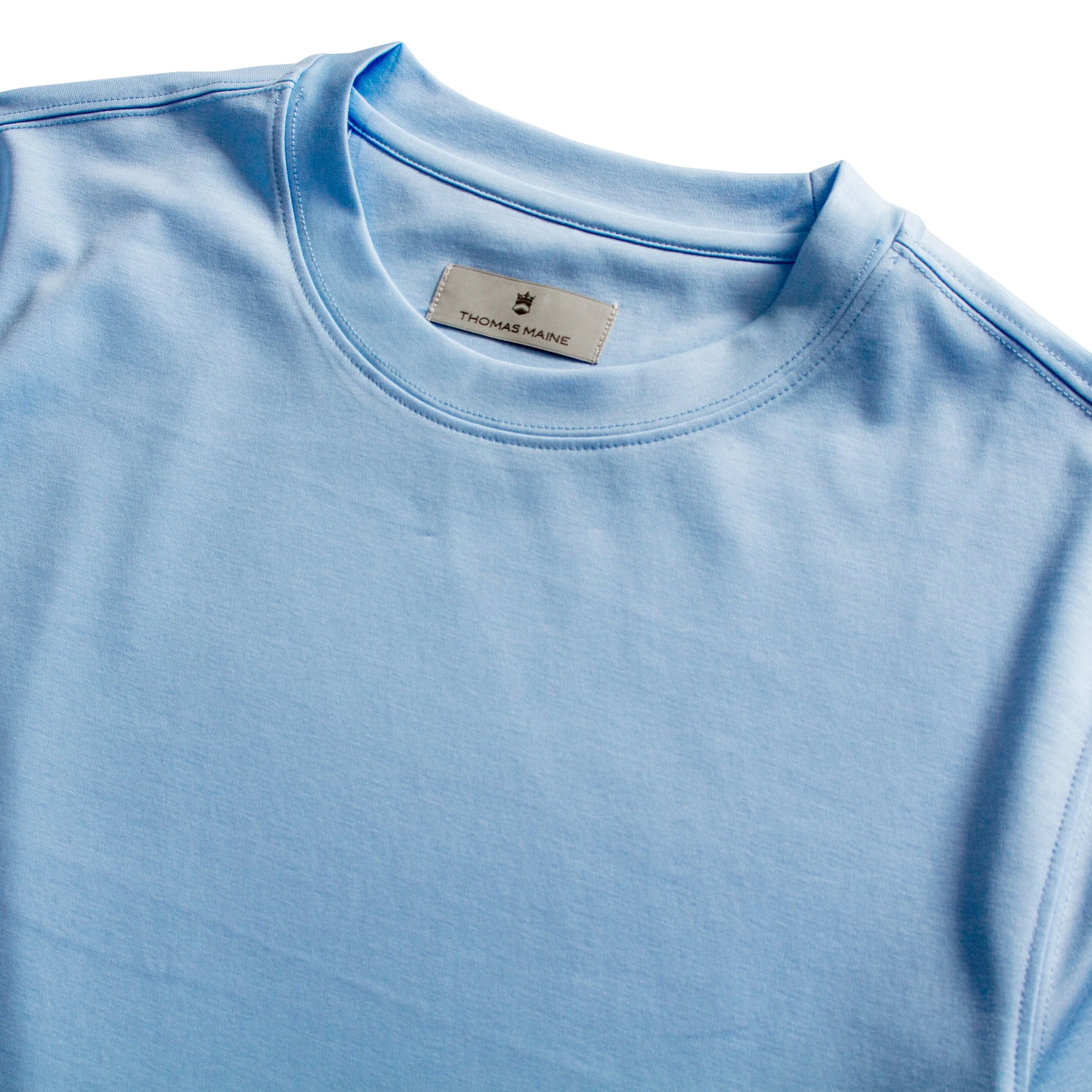 Close up image of Thomas Maine t-shirt in a light blue.