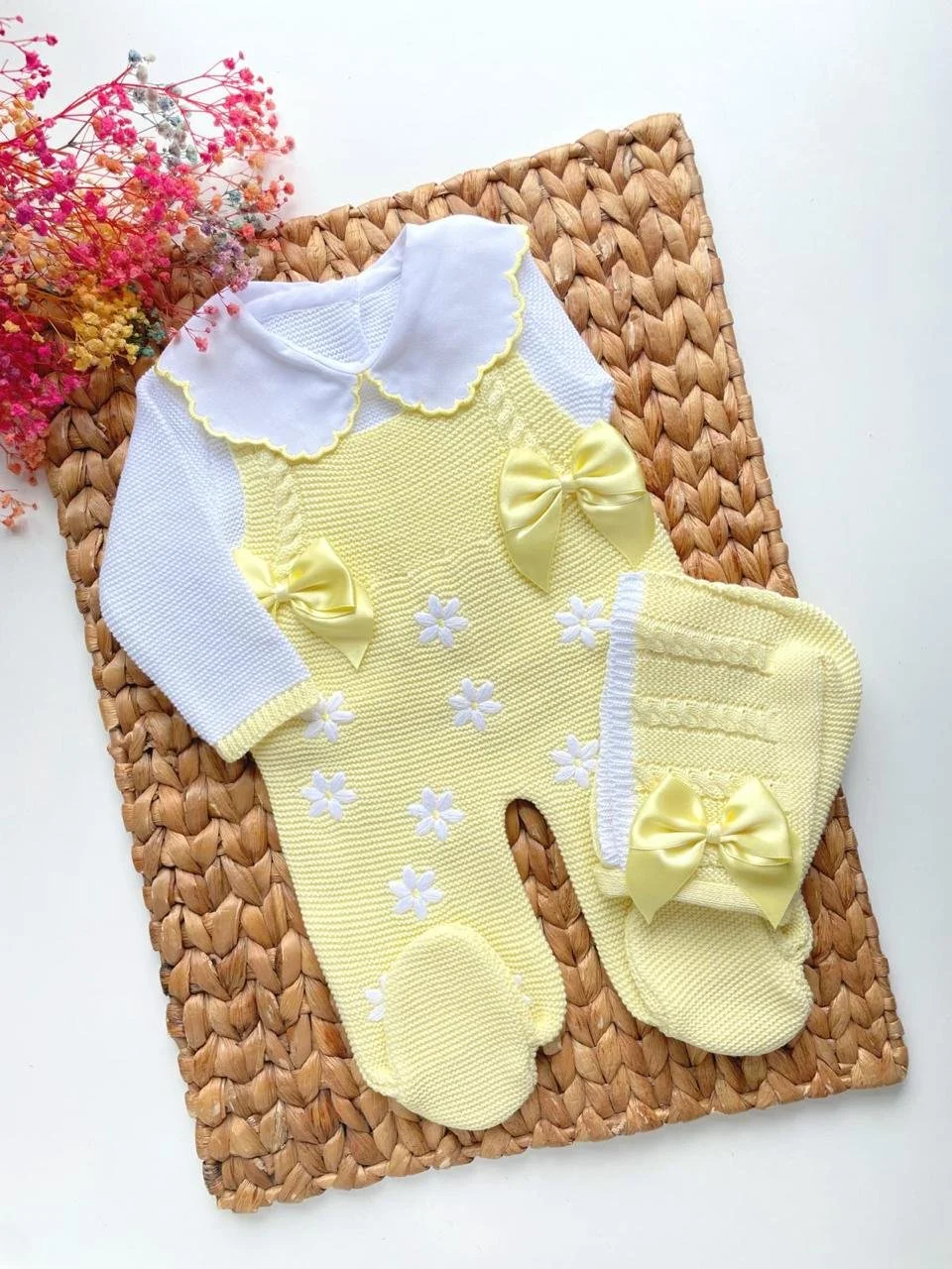 Knitted baby's first outfit with embroidered flowers; light yellow and white; "Lucia" design