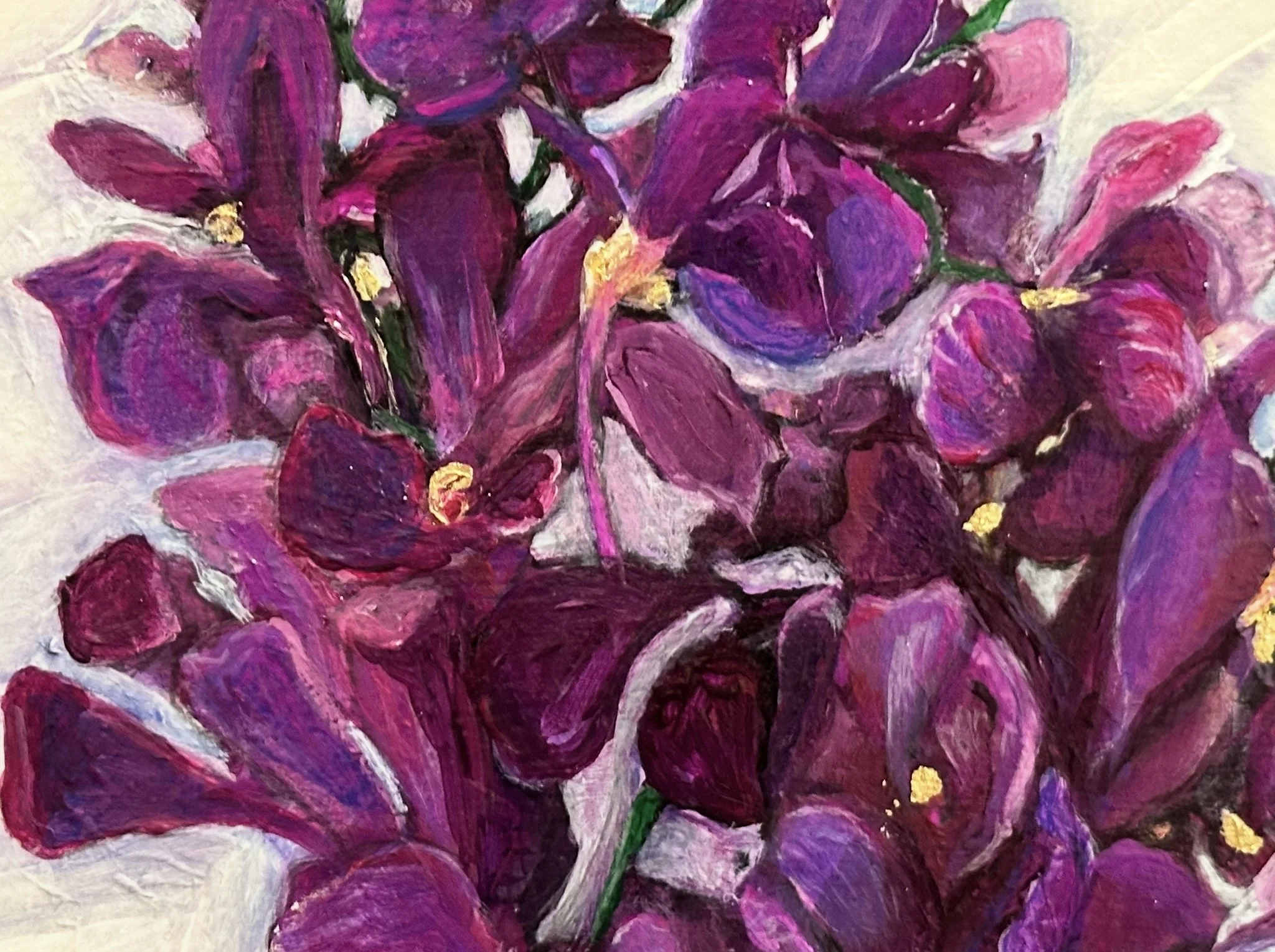 Close-up of a colorful painting of purple and pink flowers with yellow centers.