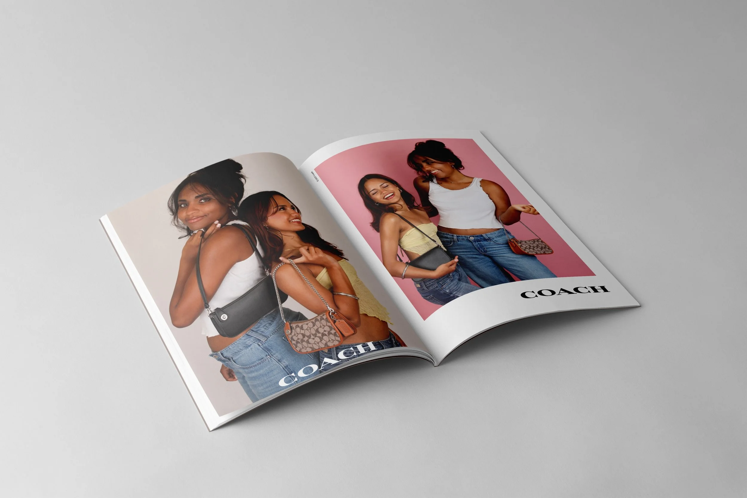 Open fashion magazine displaying a photoshoot of three young women smiling and posing with Coach handbags, against pink, beige, and white backgrounds.