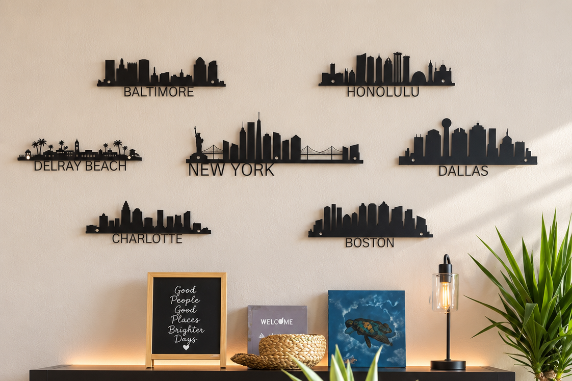 Wall decor featuring black metal city skyline silhouettes of Baltimore, Honolulu, Delray Beach, New York, Dallas, Charlotte, and Boston.