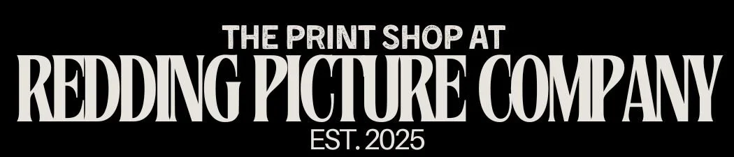 Black banner with white text reading "The Print Shop at Redding Picture Company Est. 2025".