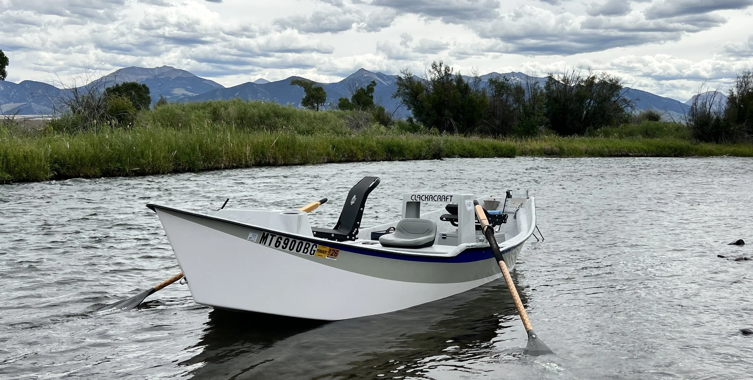 drift boat anchored on the madison river.