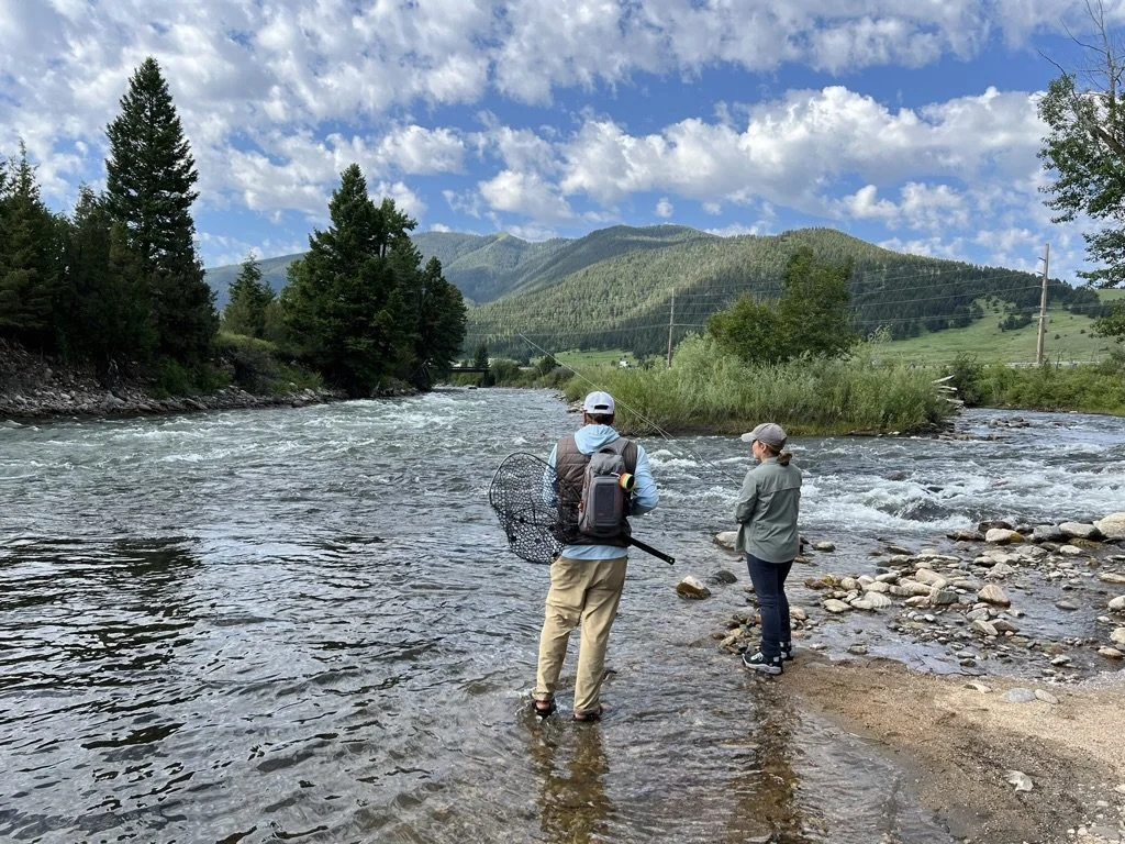 Angler with a Guide on the Gallatin River learning to fly fish