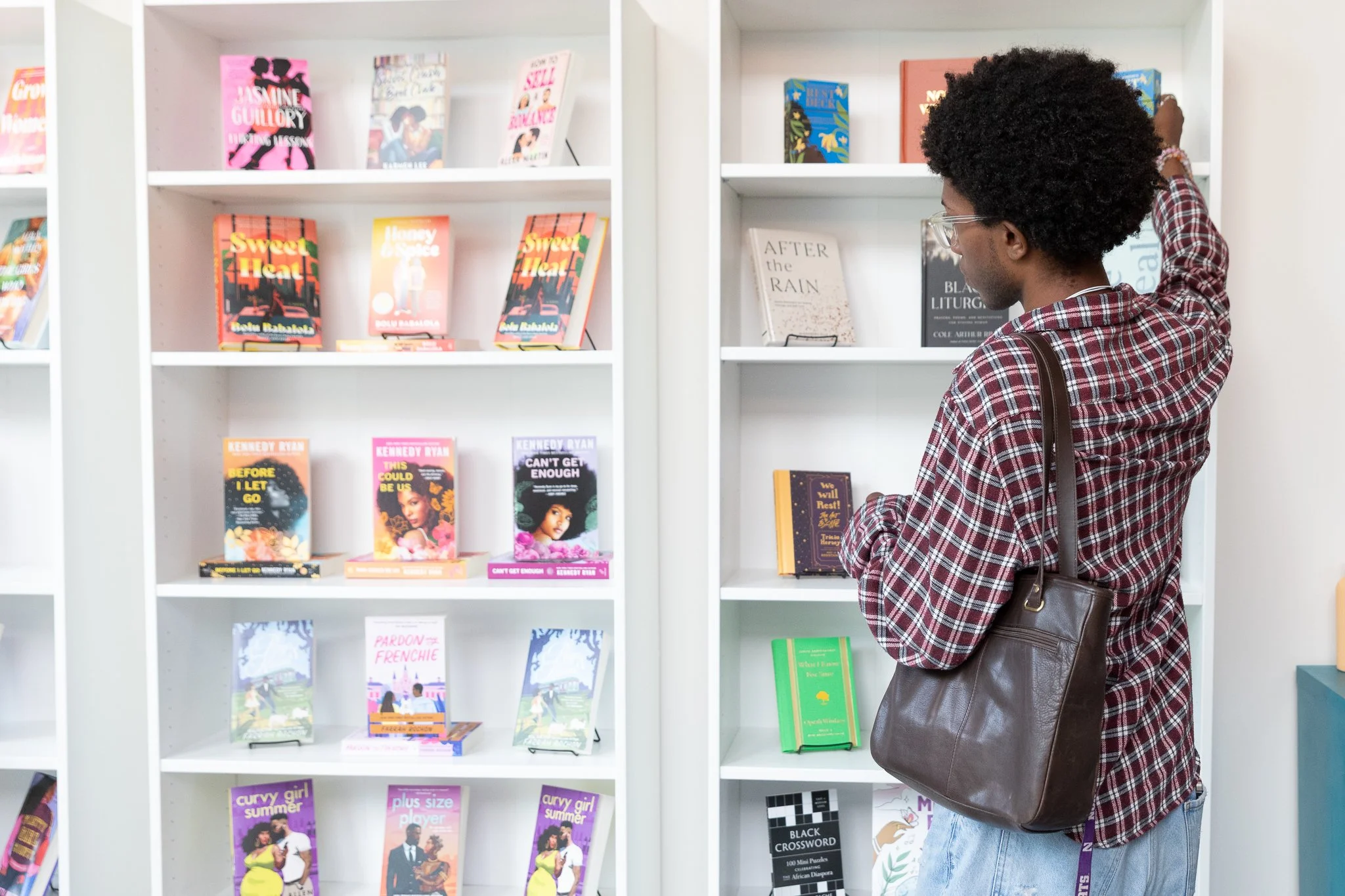 Picture of a Black person shopping at Zora's Place, a Black feminist bookstore in Evanston, Illinois