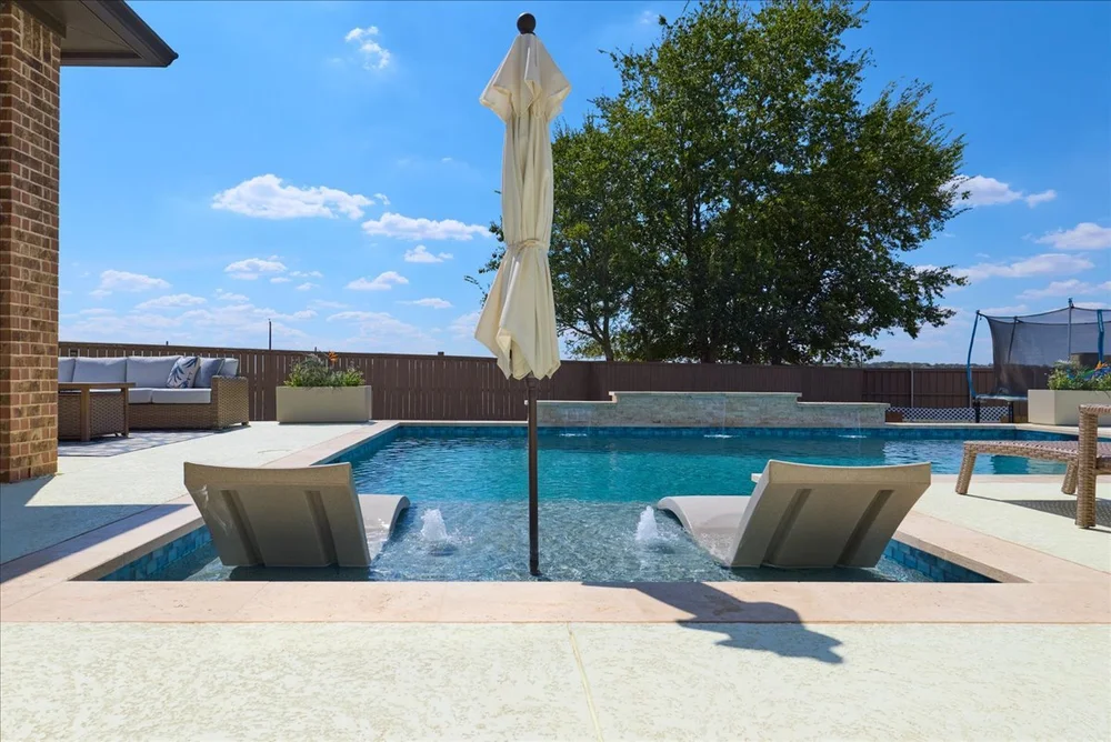 Bastrop pool with sunset view — Aqua Logistics Custom Pools