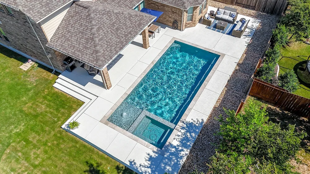 Aerial view of custom pool and outdoor living — Austin TX