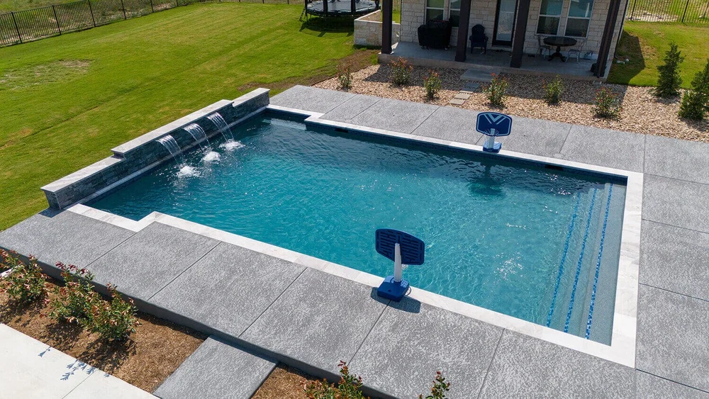 Pool with basketball hoops and water features