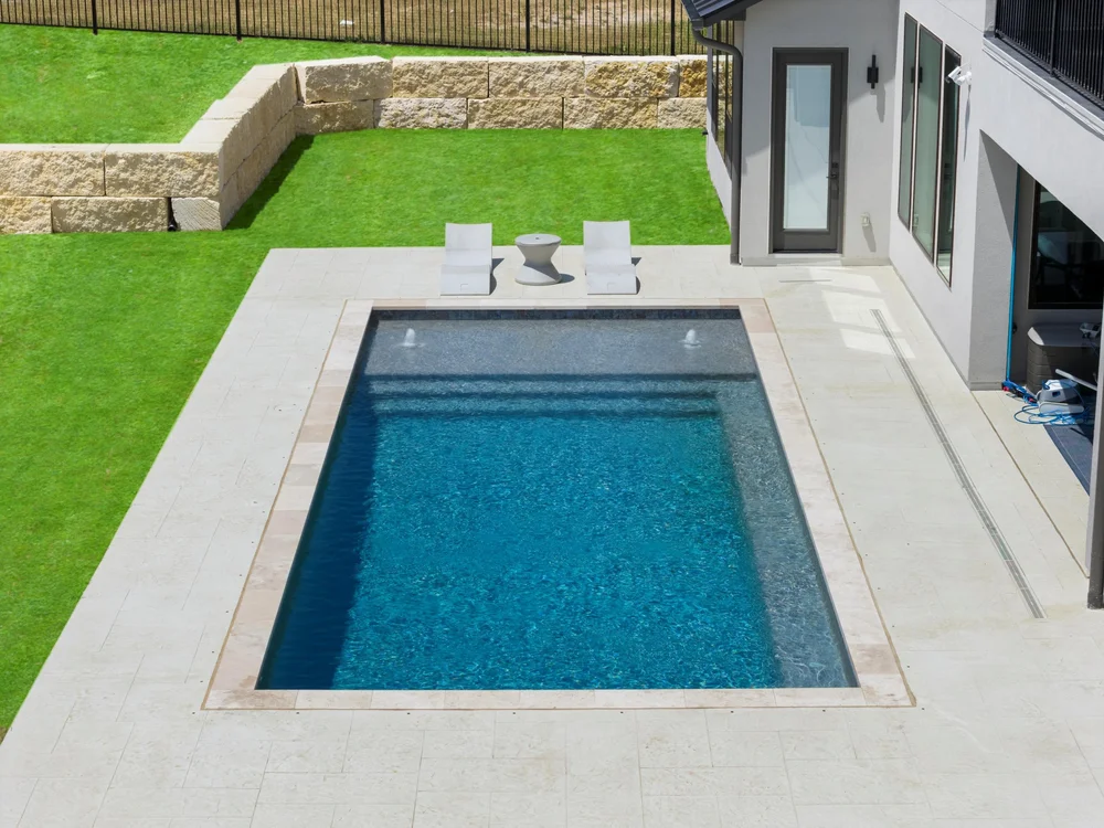 Pool with outdoor seating — Dripping Springs
