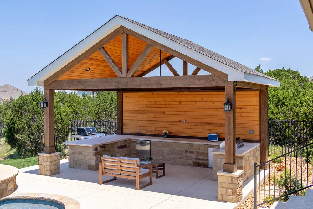 Outdoor kitchen under wooden pavilion — Central Texas