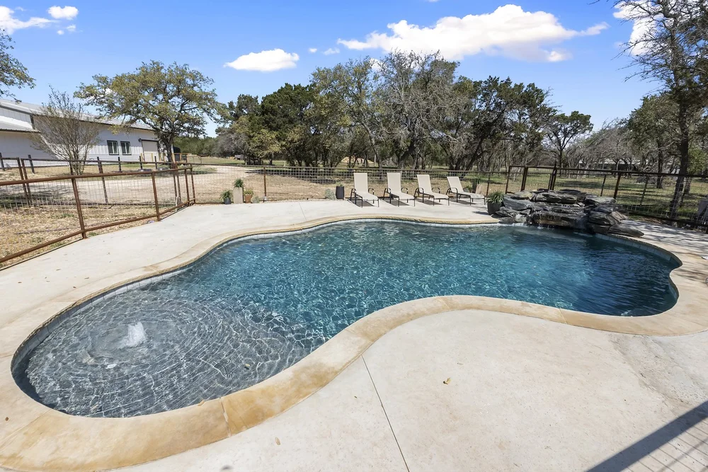 Freeform pool shape and decking — Spivey Leander TX