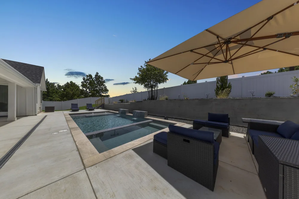 Bastrop pool with outdoor seating area