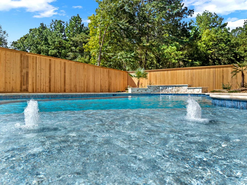 Custom gunite pool with privacy fence — Austin TX