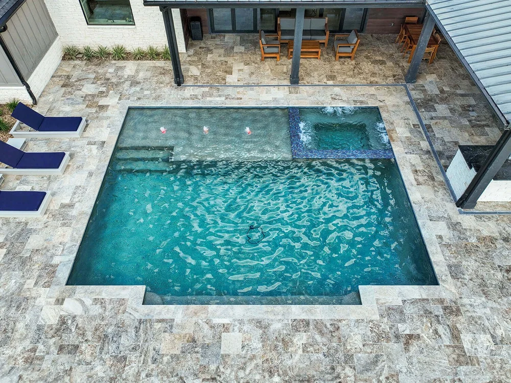 Modern pool with spa and lounge chairs — Aqua Logistics Custom Pools