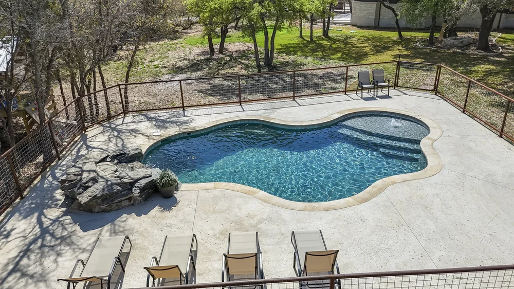 Pool with lounge chairs — best Austin pool builder