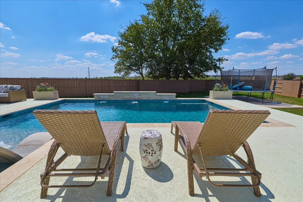 Ivory Travertine coping and pool deck detail — Bastrop TX
