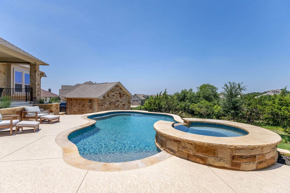 Freeform pool with raised spa — Austin TX