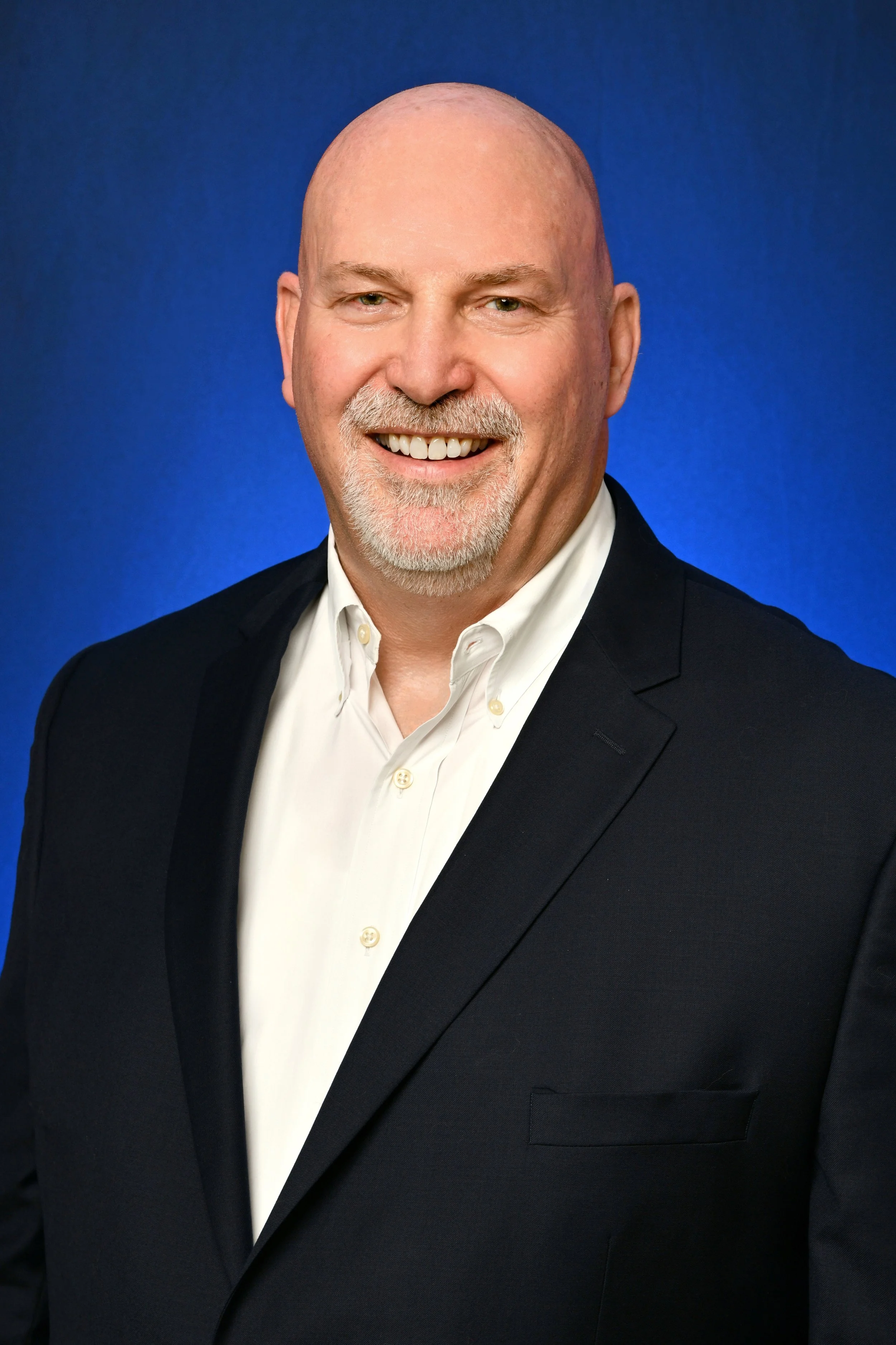 Man in black business suit with mustache