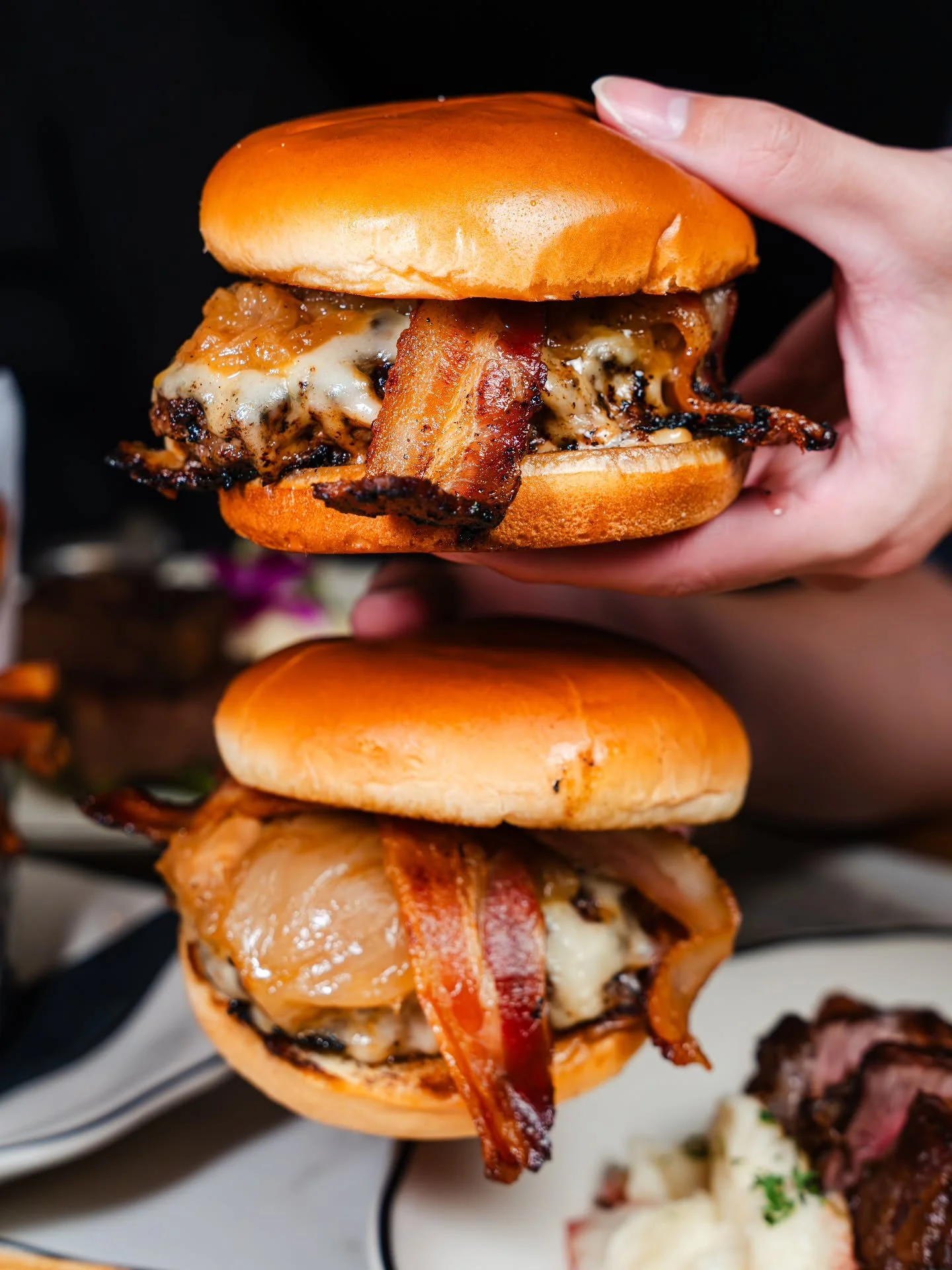 Bone marrow burgers: rich, juicy, and worth every bite.

For when a regular burger just won&rsquo;t cut it!

Have one tonight!

.
.
.

#thebutcherbar #bonemarrowburger #bonemarrow #applewoodbacon #hawaiirestaurants #waikikidining #zetton