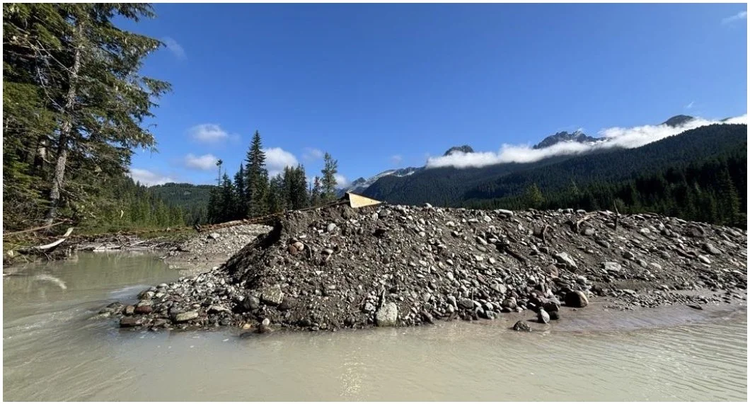 The automated bucket dragging sediments at Skookum Creek. This automated system is one of Sea to Sky Energy Solution's licensed technologies.