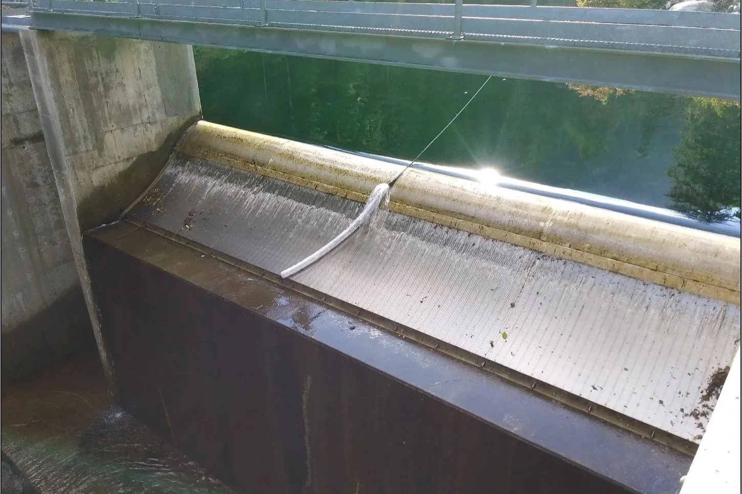 The Automated Coanda Screen Cleaner brush, being dragged alone the coanda screen at the Haa-ak-suuk Creek.