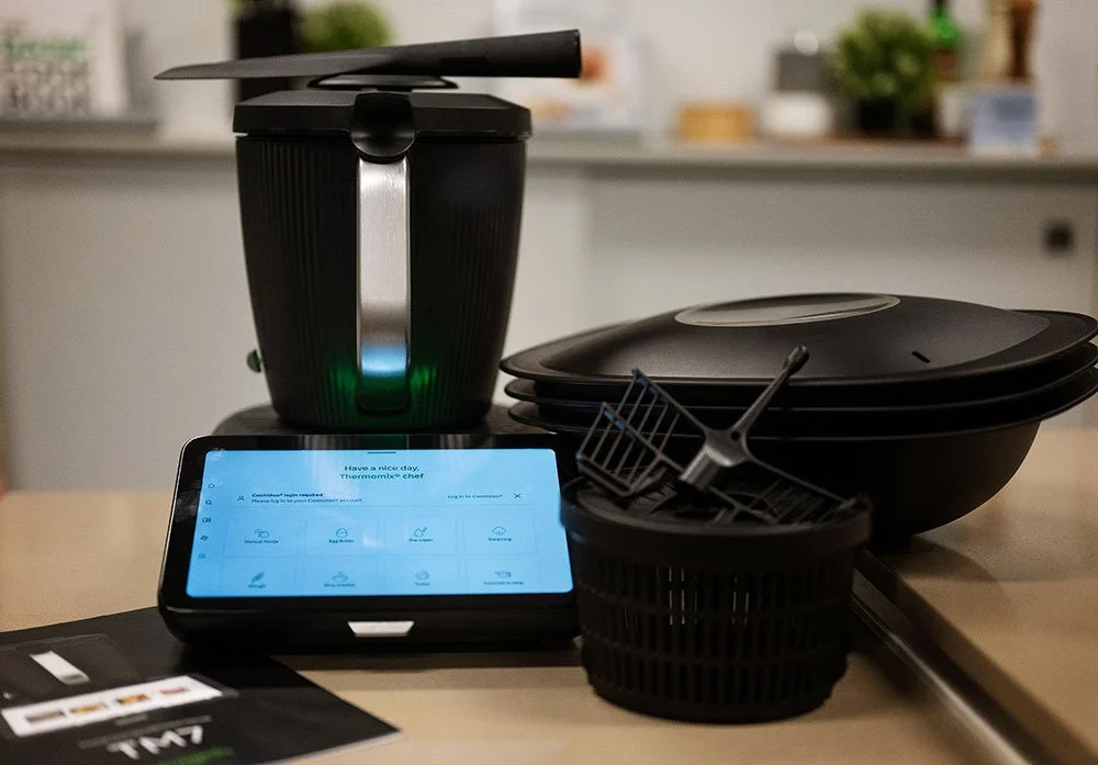 Thermomix on a counter with various parts