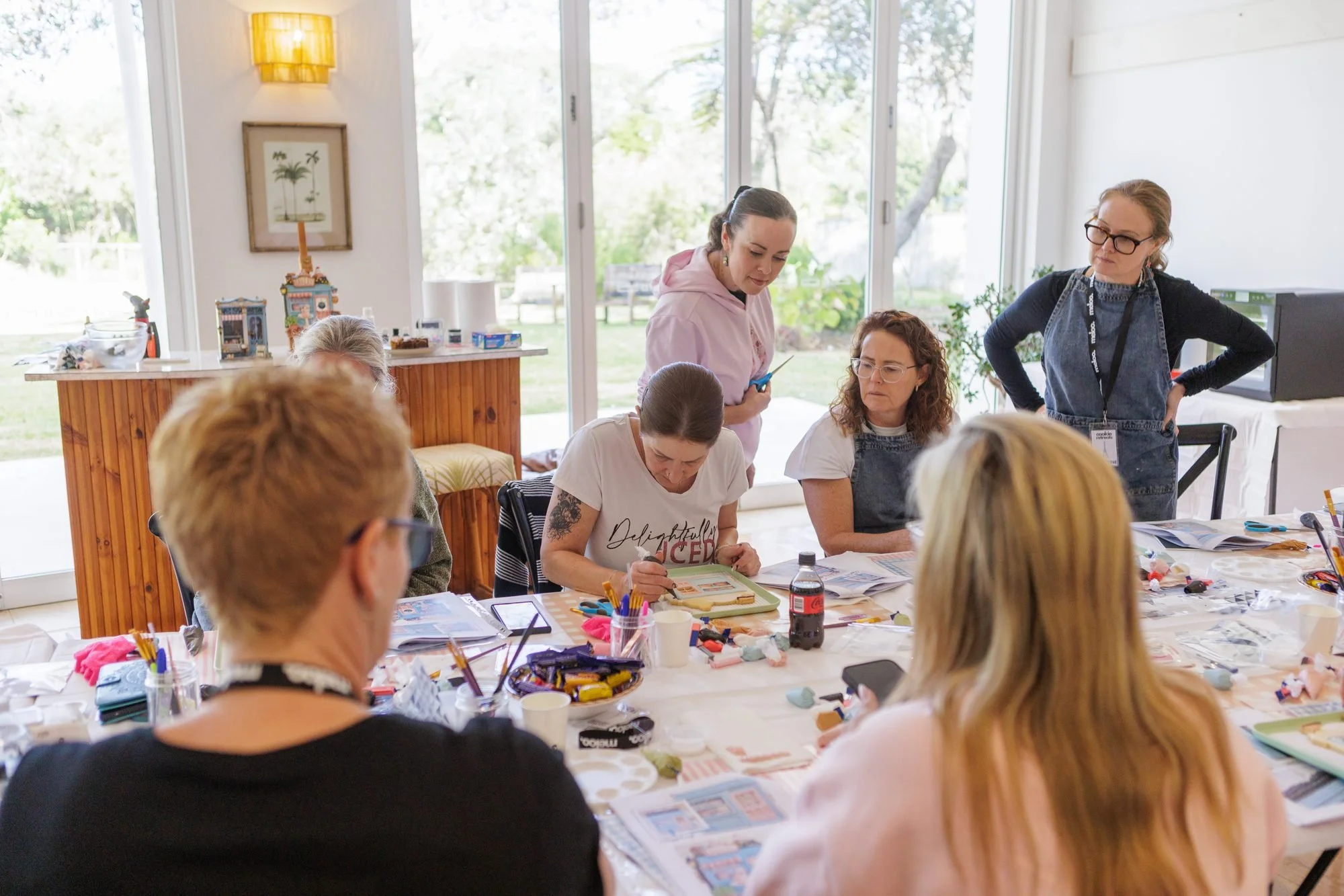 Guests decorating cookies together at the cookie retreat