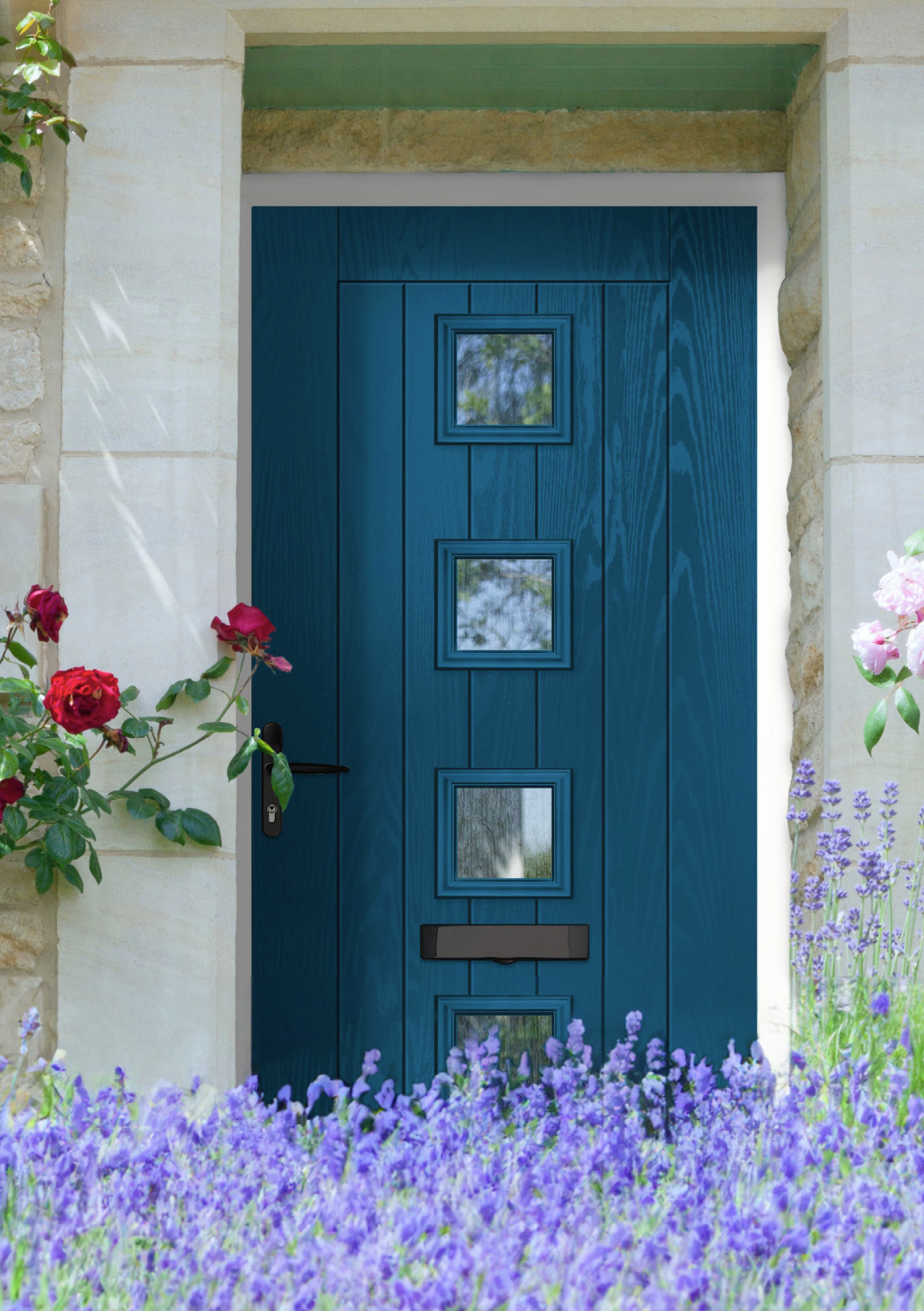 Blue front door with three small square windows, surrounded by colorful flowers and greenery.