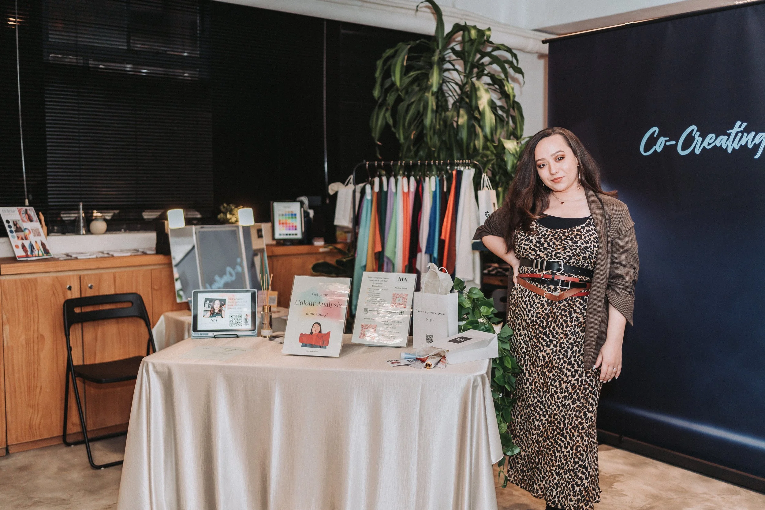 Miss Analyst at Runway Asia 2025 The Hive Hong Kong standing at colour analysis booth for seasonal colour analysis sessions and styling services