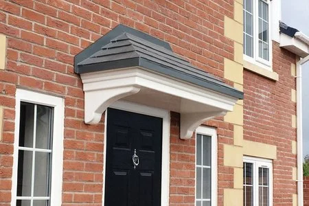 a cheap grp door canopy which a grey grp roof