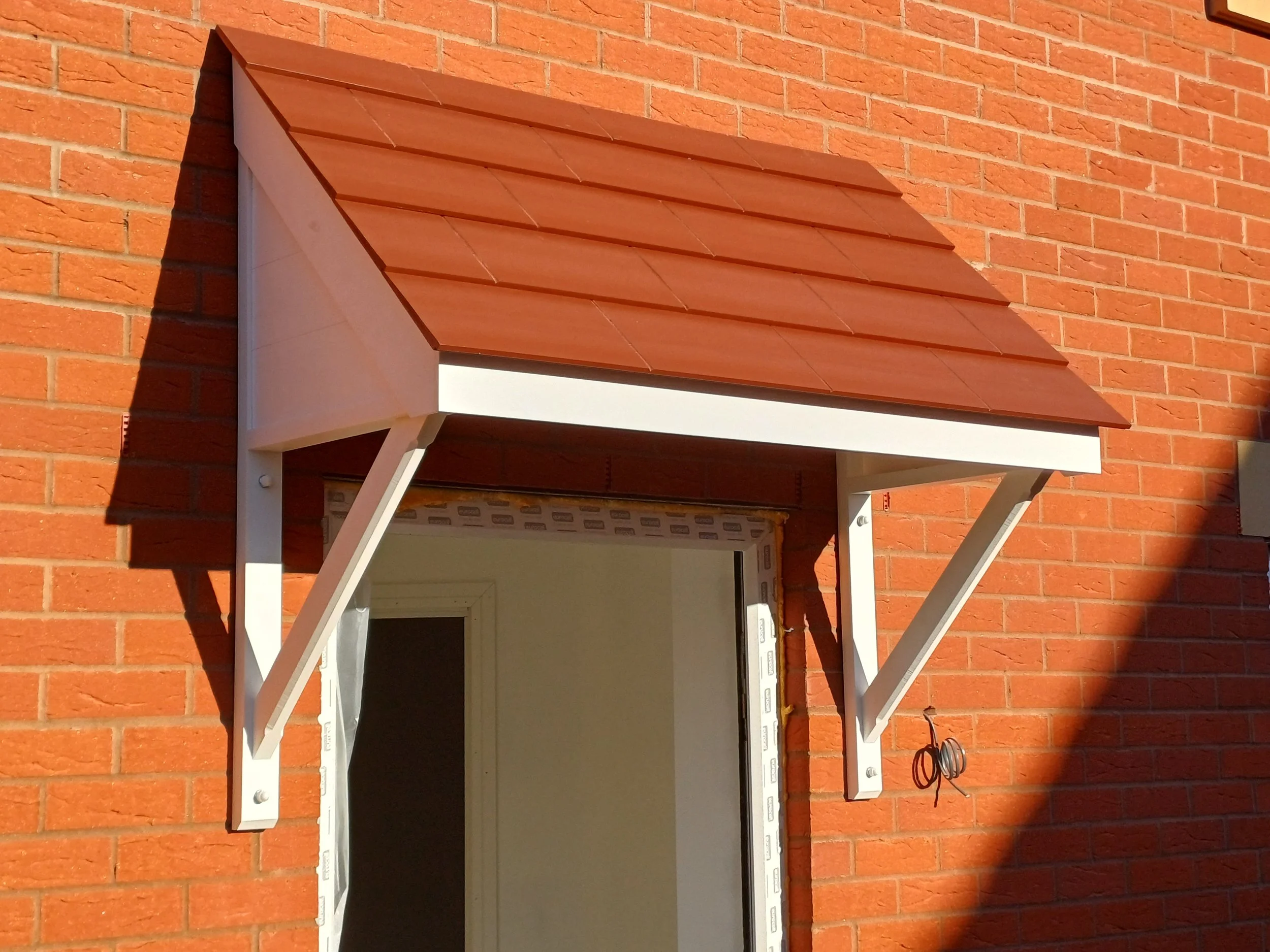 mono door nanopy with sloping roof